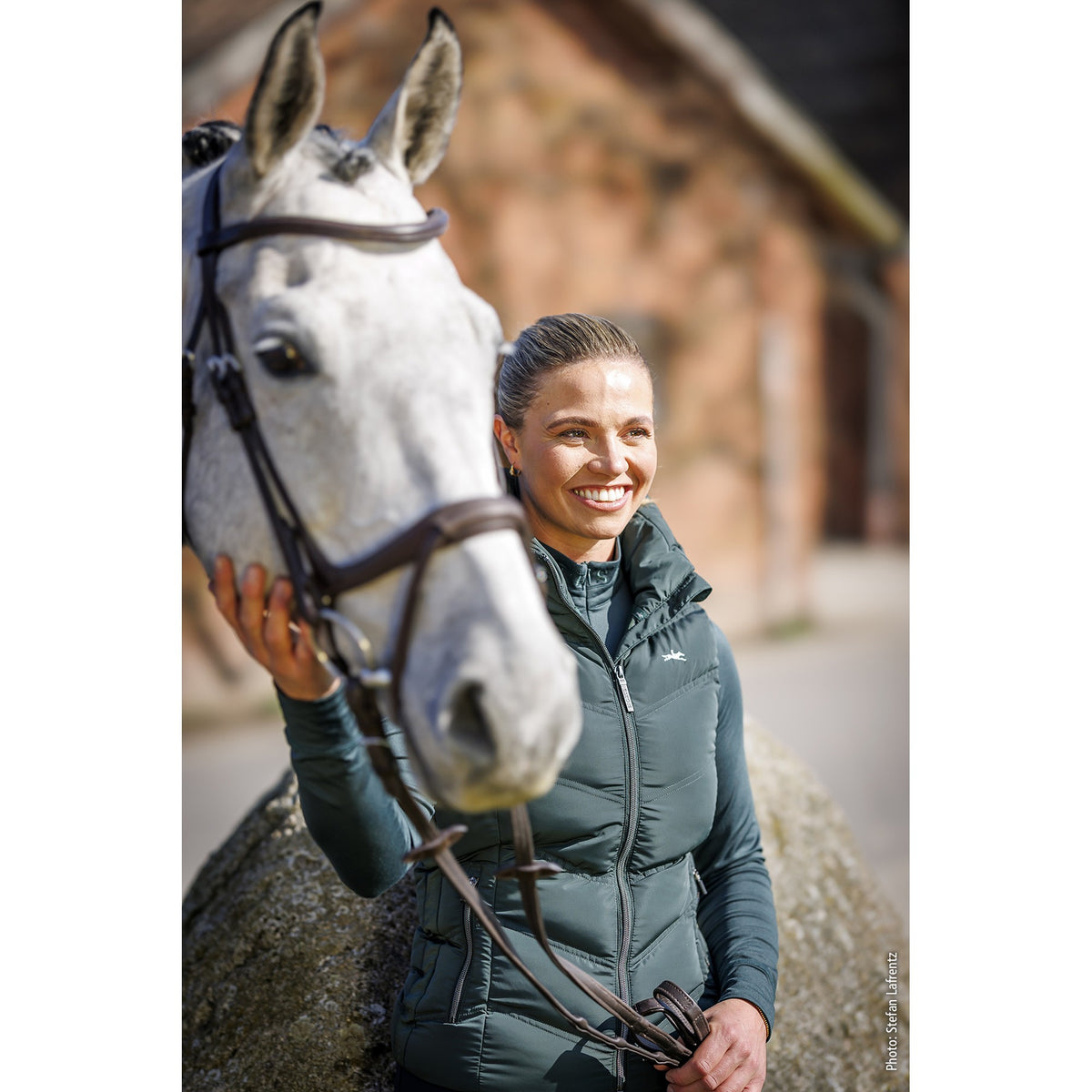 Schockemöhle Marleen Style Women's Padded Vest in Bottle worn at the barn