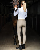 Schockemöhle Darleen Classic Knee Grip Breech - on rider, shown full length standing with horse | Malvern Saddlery