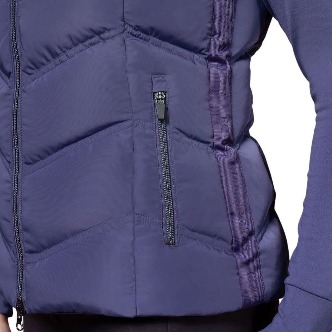 Schockemöhle Sports SPMarleen Style Quilted Ladies Vest - Ink Blue, detail side pocket and grosgrain on person againstwhite background | Malvern Saddlery