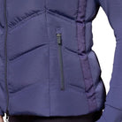Schockemöhle Sports SPMarleen Style Quilted Ladies Vest - Ink Blue, detail side pocket and grosgrain on person againstwhite background | Malvern Saddlery