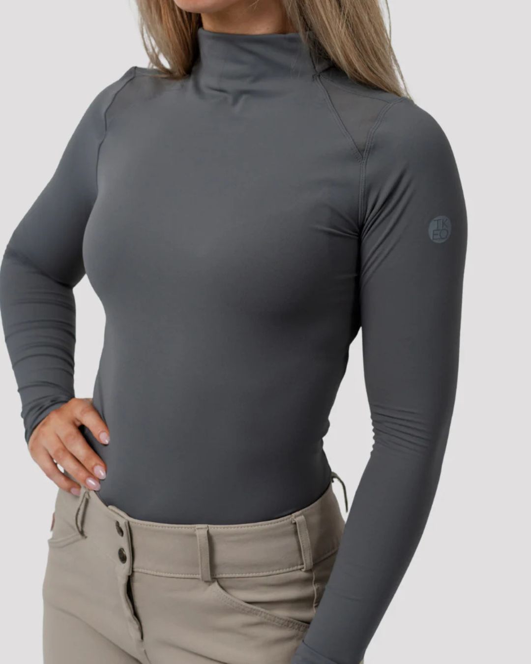 TKEQ CHLOE High Collar Technical Top - Slate Gray, on person with white background | Riding Apparel | Malvern Saddlery