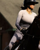 TKEQ Kennedy Seamless 2.0 Long Sleeve Shirt - Silver Ombre; shown on woman riding horse | Athleisure | Malvern Saddlery