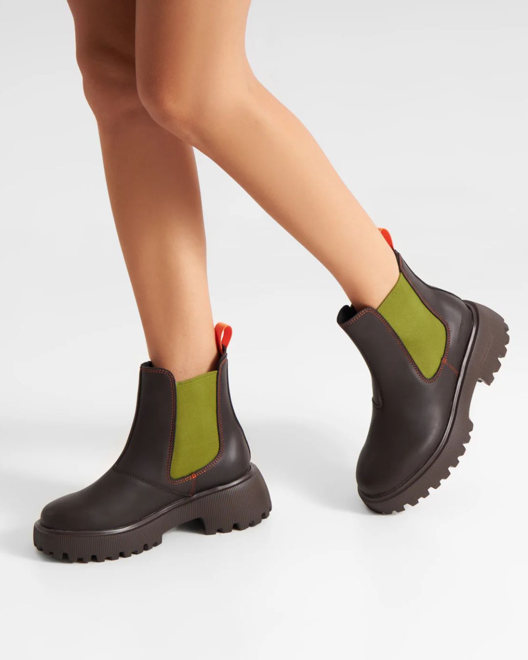 Woden Aya Waterproof Boot - Chocolate/Bambus Green, worn by person on white background | Style Footwear | Malvern Saddlery