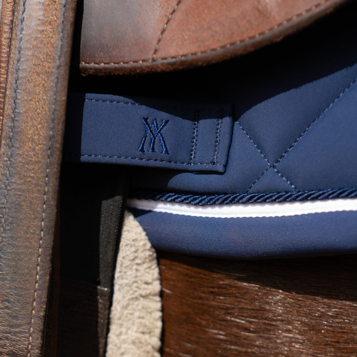 Yagya Performance Jump Saddle Pad - Navy, girth strap detail | Malvern Saddlery