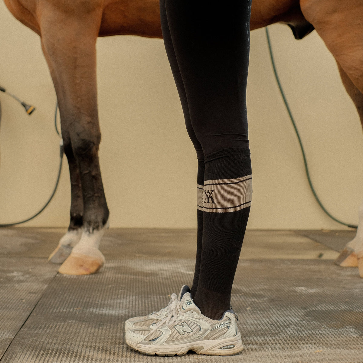 Yagya Signature Riding Sock - Black/Tan, worn standing | Malvern Saddlery