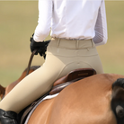 WON Equestrian Stay Dry Waterproof Breeches - Beige, shown on rider on horse | Malvern Saddlery