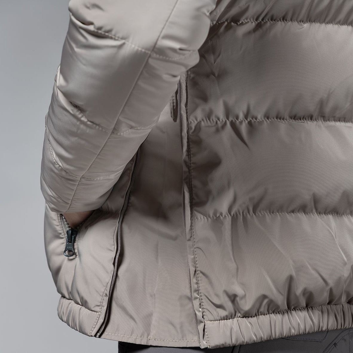 Schockemöhle Violet Puffer Jacket - Hazel; side zip detail on woman| Women's Outerwear | Malvern Saddlery