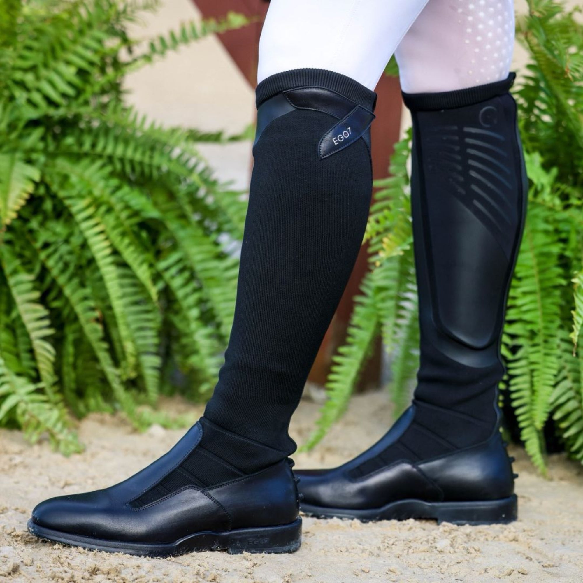 EGO7 Contact black zipper-free technical knit equestrian tall boots worn on rider, side profile view