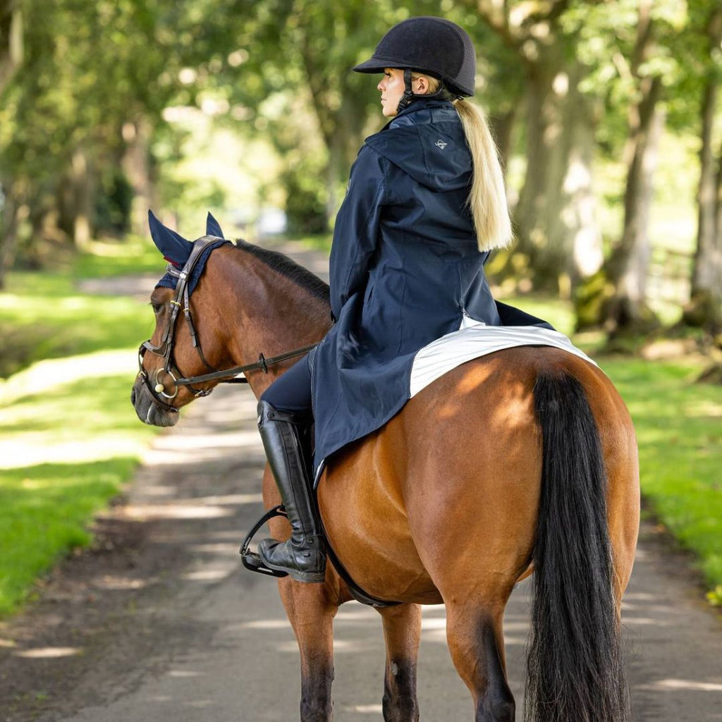 LeMieux Amelie Ladies' Lightweight Riding Coat - Navy - rider on horse| Malvern Saddlery