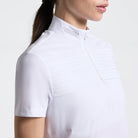 Cavalleria Toscana Women's Short Sleeve Pleated Competition Shirt - White; close up neck and chest on model on white background | Equestrian Show Shirts | Malvern Saddlery