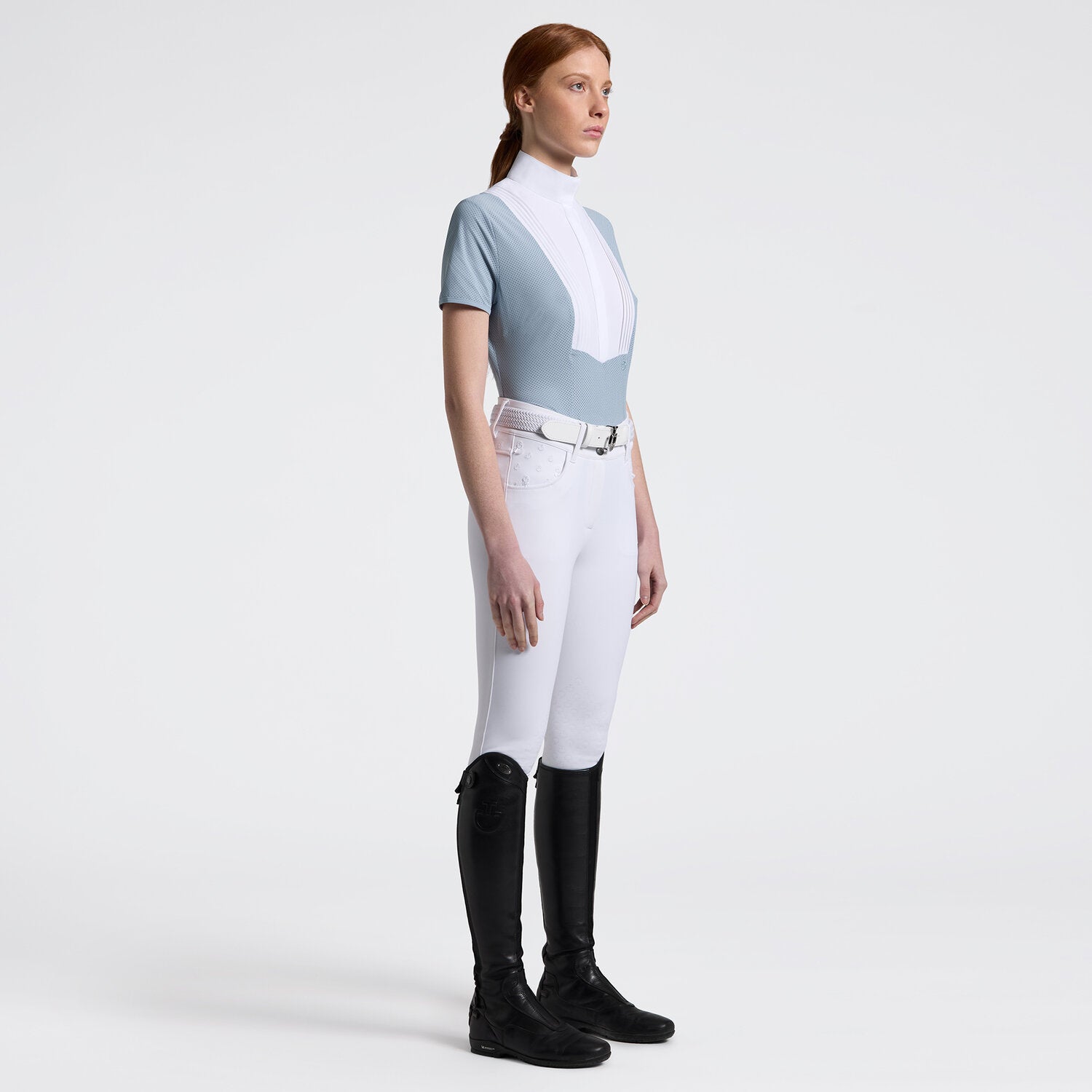 Cavalleria Toscana Women's Competition Shirt in Technical Jersey with white poplin colllar & hidden buttons - light blue, shown on model with white breeches, riding boots | Equestrian Show Shirts  | Malvern Saddlery