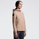 Cavalleria Toscana Women's Perforated Jersey Softshell Jacket - Brush [Beige]; shown on Woman wearing black pants on a white background | Ladies Riding Outerwear | Malvern Saddlery