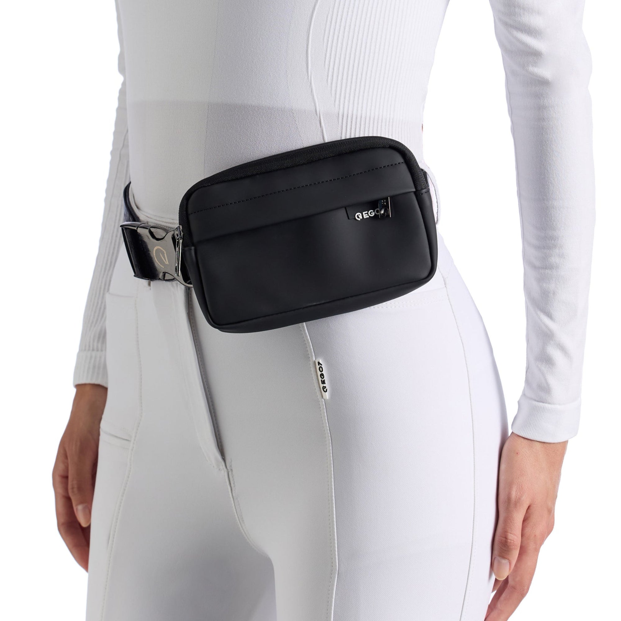 EGO7 Agnes Pouch in black worn as a waist belt bag over white equestrian riding pants