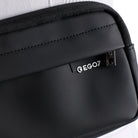 Close-up of the waterproof soft-touch fabric and raised EGO7 logo detail on the black Agnes Pouch