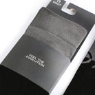 Close-up of packaged EGO7 MV riding socks in grey and black with branded cardboard sleeve