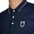Equestro Men's Training Polo Shirt - Navy Blazer with White contrast details; chest logo close up shown on model on white background | Men's Riding Apparel | Malvern Saddlery