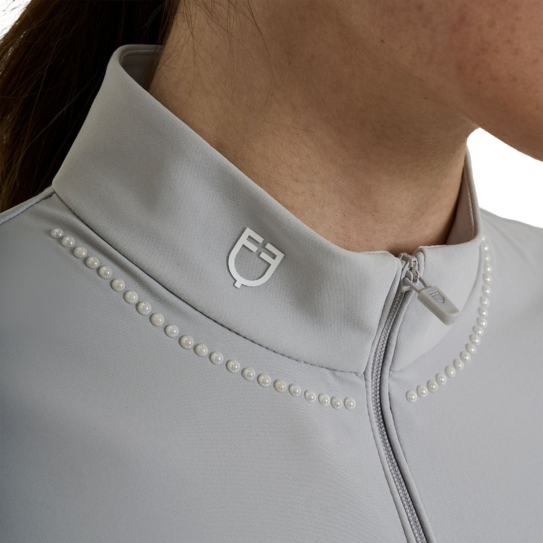 Equestro Women's Training Polo Quarter Zip with beaded collar detail - Harbor Mist Gray; close up of bead & zip detail shown on woman, white background | Riding Shirts | Malvern Saddlery