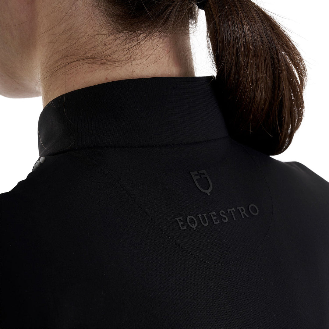 Equestro Women's Training Polo Quarter Zip with beaded collar detail - Black; back of neck logo detail shown on woman, white background | Riding Shirts | Malvern Saddlery