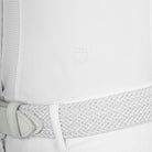 Equestro Women's Long Sleeve Competition Shirt - White; close up of logo above left waist shown on model on white background | Show Shirts | Malvern Saddlery