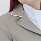 For Horses NORA Show Jacket - Beige; collar contrast detail shown on woman on white background | Women's Equestrian Competition Coats | Malvern Saddlery