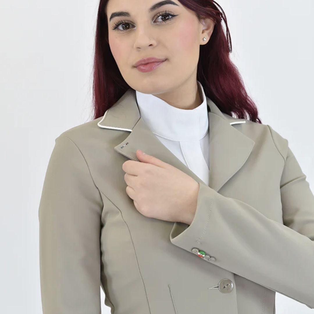 For Horses NORA Show Jacket - Beige; close up shoulders chest shown on woman on white background | Women's Equestrian Competition Coats | Malvern Saddlery