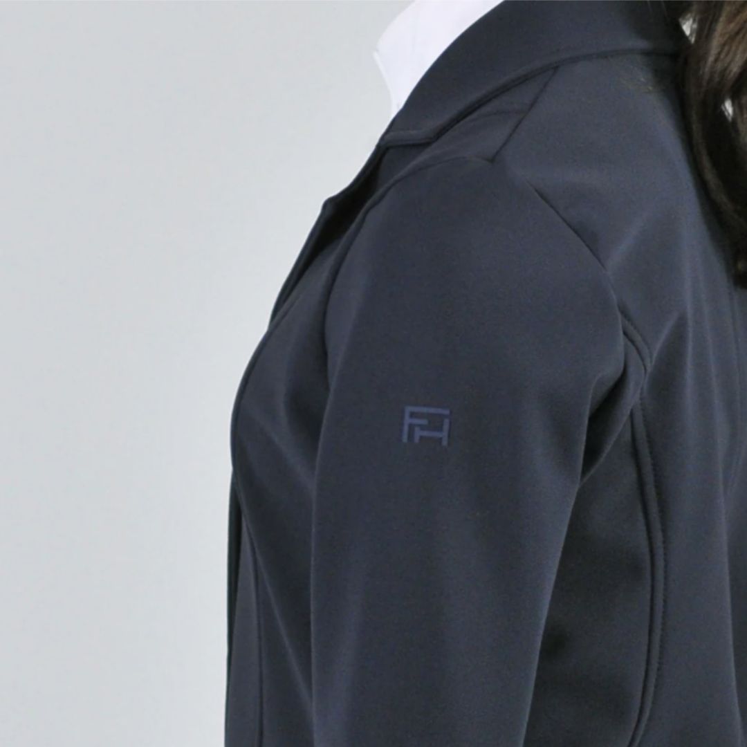 For Horses Winx Hunter Girls Show Jacket - Navy; close up left shoulder with logo shown on young rider  | Young Rider Competition Clothing | Malvern Saddlery
