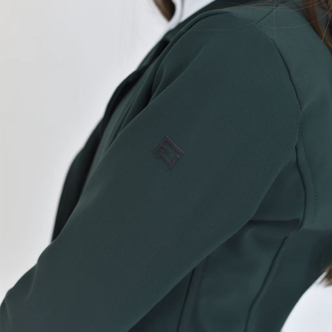 For Horses Winx Hunter Girls Show Jacket - Green; close up of left shoulder with logo shown on young rider  | Young Rider Competition Clothing | Malvern Saddlery