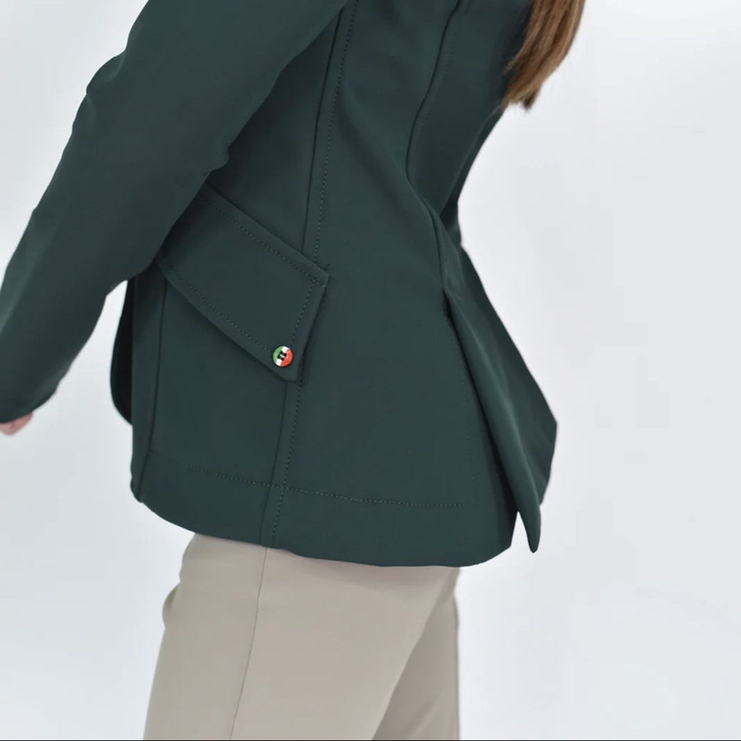 For Horses Winx Hunter Girls Show Jacket - Green; detail of left pocket with Italian flag colors on button shown on young rider  | Young Rider Competition Clothing | Malvern Saddlery