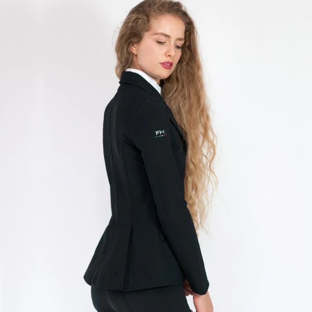 For Horses YAKIE Show Jacket - Black | Competition Riding Apparel; side view shown on woman on gray background | Malvern Saddlery