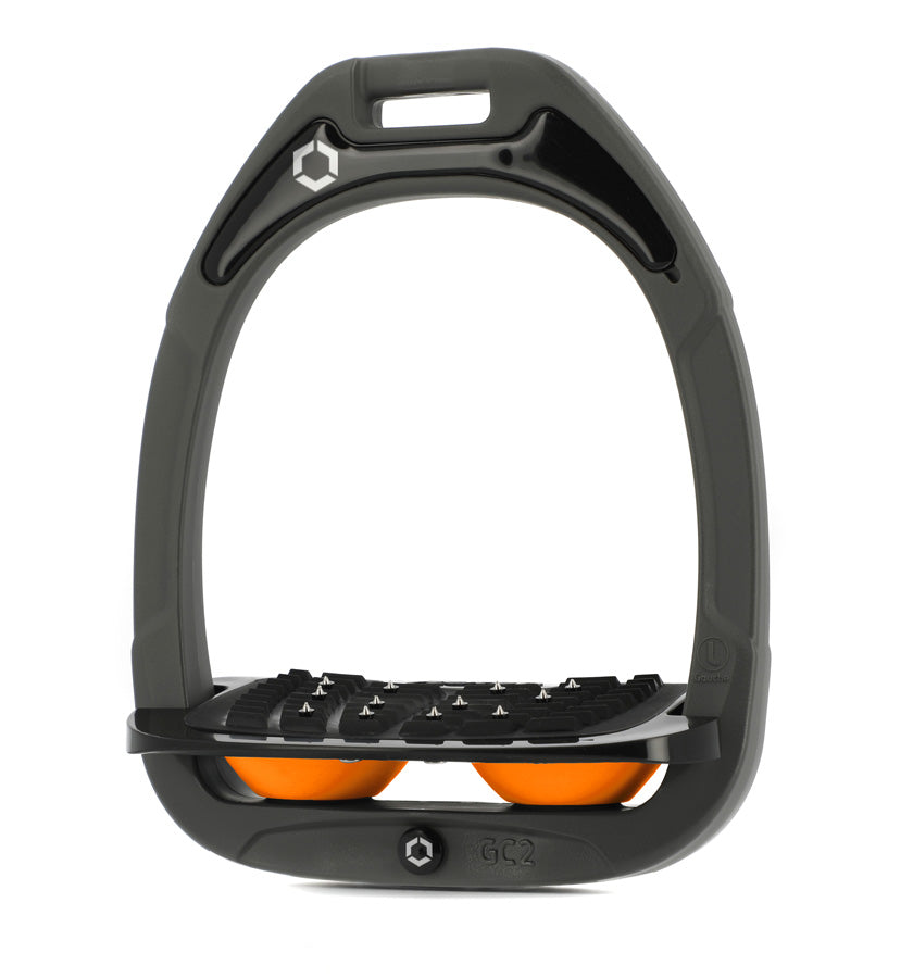 Flex-On Composite Equestrian Stirrups - Dark Gray - with Black Inclined Ultra Grip Footbed; orange shock absorbers | Malvern Saddlery