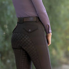 Halter Ego Evolution Mid Rise Full Seat Breeches - Mocha Brown, close up back view of waist & seat  on woman against blurred green background | Women's Riding Pants | Malvern Saddlery
