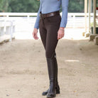 Halter Ego Evolution Mid Rise Full Seat Breeches - Mocha Brown, on woman outside of barn wearing riding boots | Women's Riding Pants | Malvern Saddlery
