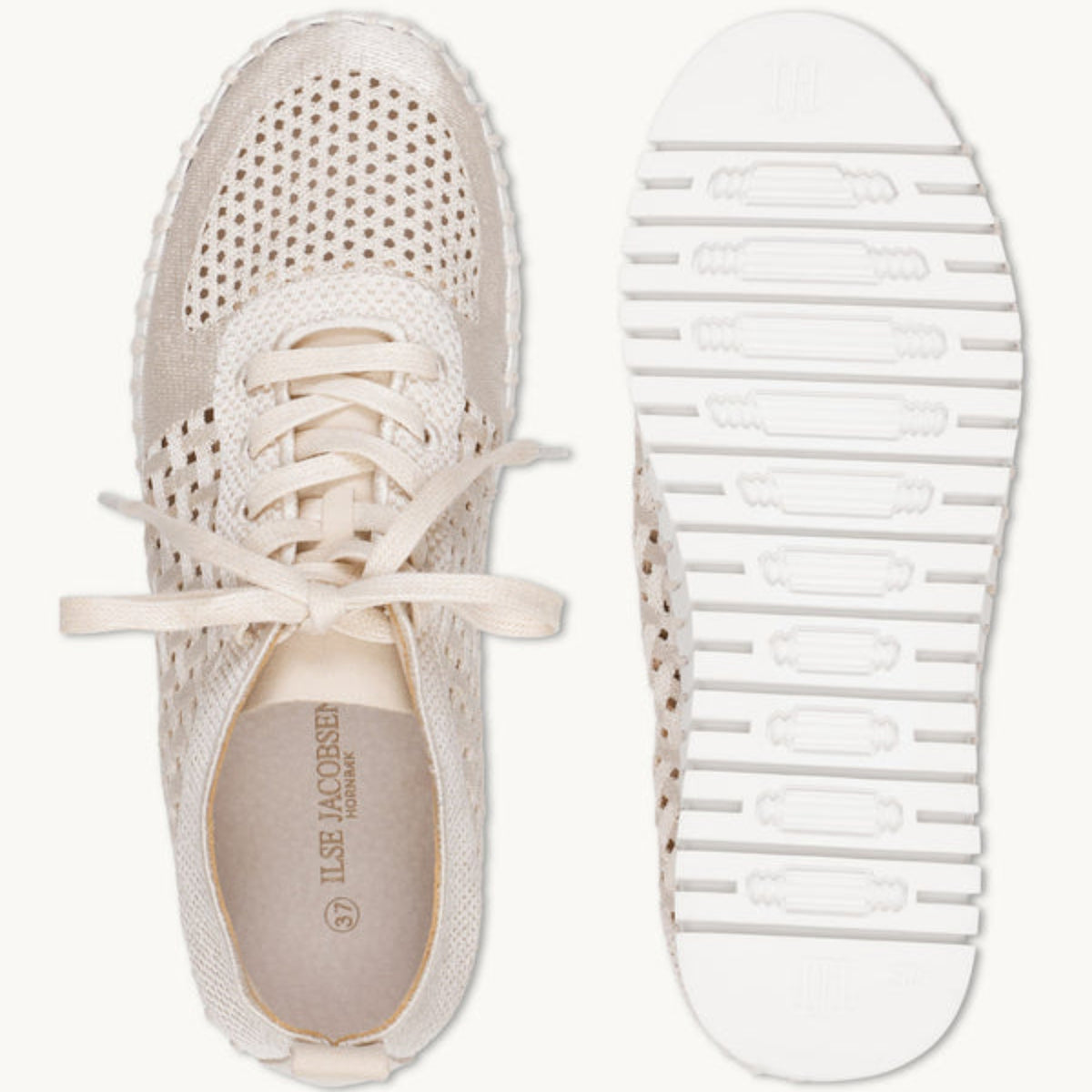 Top-down view of the Ilse Jacobsen Tulip 4271 embroidered platform sneaker in Kit White next to its flexible, textured rubber tread sole