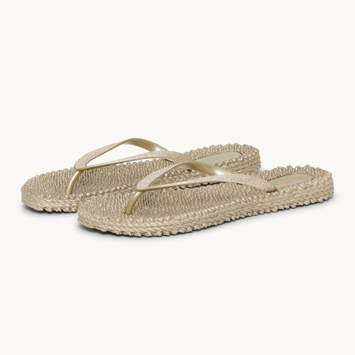 Ilse Jacobsen Cheerful platinum glitter flip flops featuring a textured massaging footbed and flexible air-rubber sole