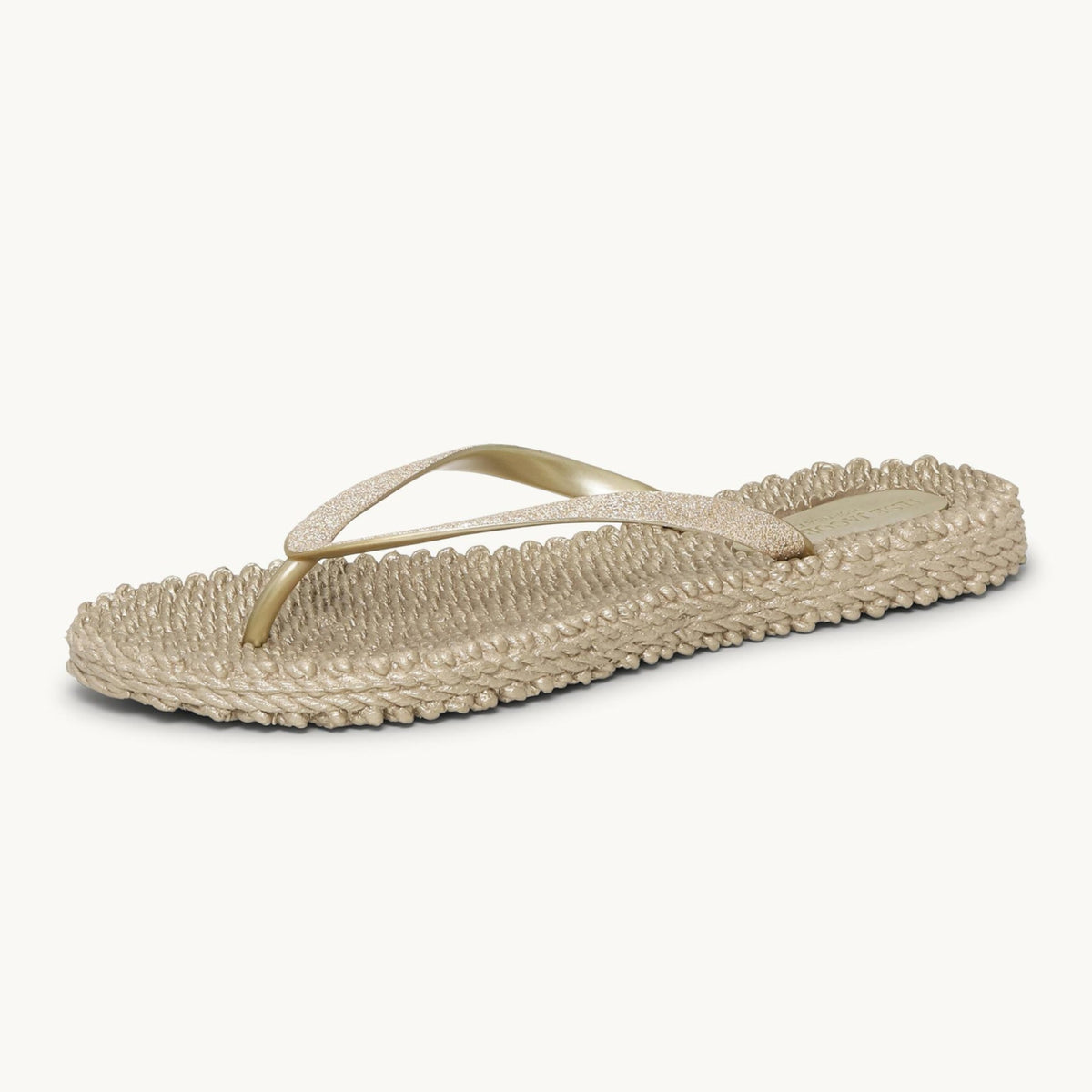 Ilse Jacobsen Cheerful platinum glitter flip flops angled view at Malvern Saddlery featuring a textured massaging footbed