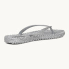 Ilse Jacobsen Cheerful silver glitter flip flops angled view featuring a textured massaging footbed