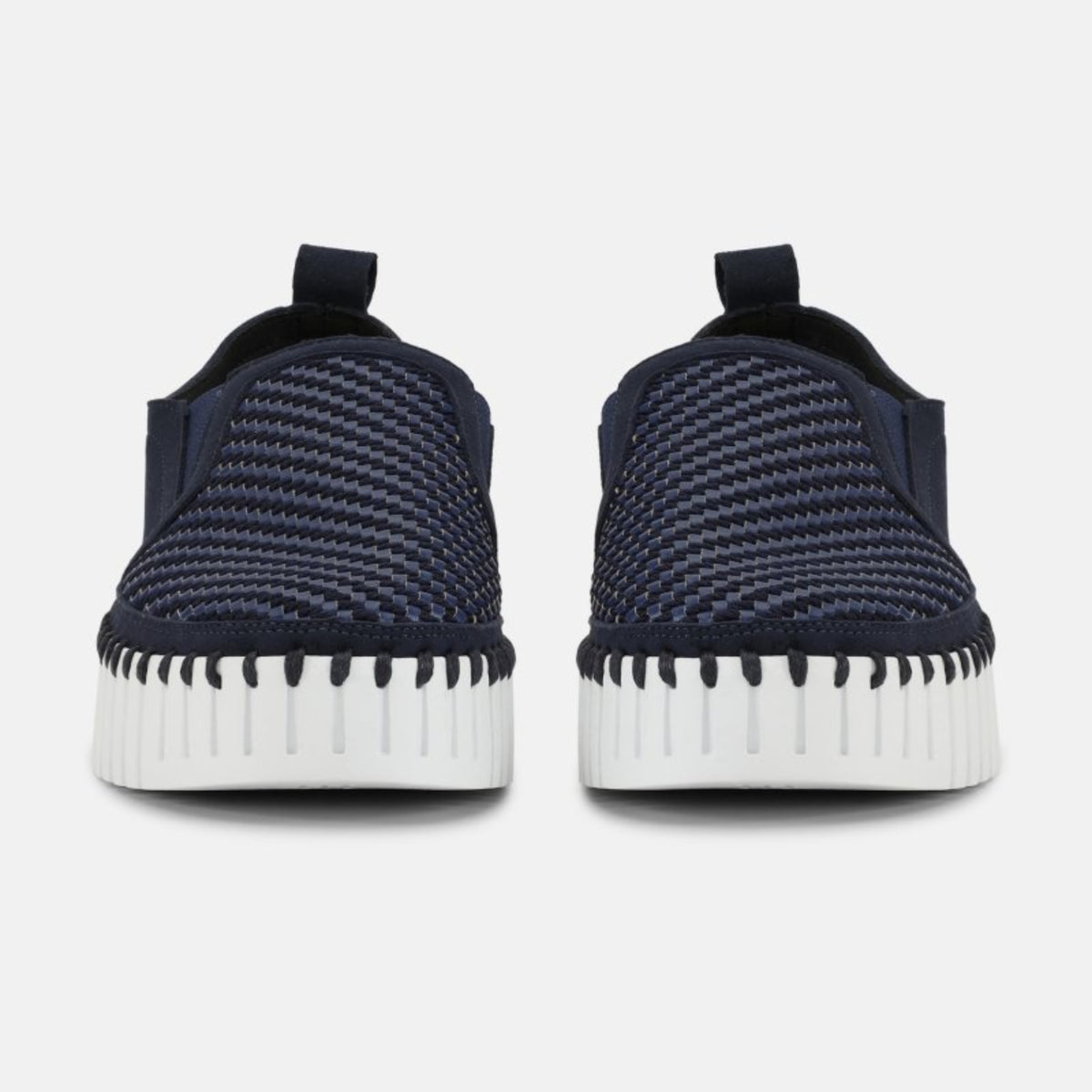 Front view of women's Ilse Jacobsen Tulip indigo blue slip-on shoes with textured woven uppers and flexible white platform soles.
