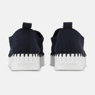Back view of women's Ilse Jacobsen Tulip indigo blue slip-on shoes featuring heel pull tabs and thick white platform soles.