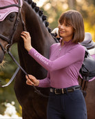 LeMieux Classique Women's Base Layer Top - Mallow Pink - shown on woman standing next to horse outdoors | Malvern Saddlery