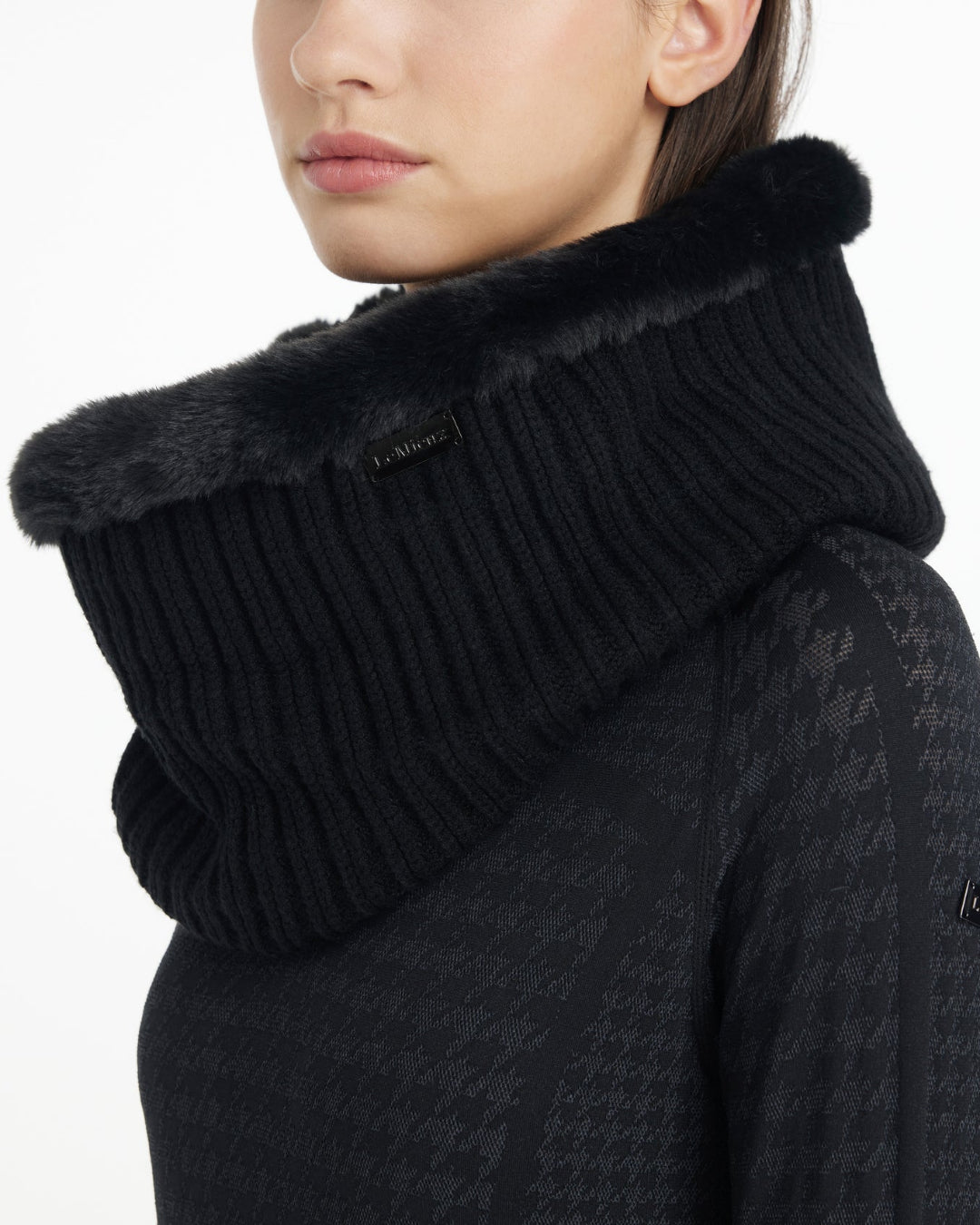 LeMieux Aspen Snood - Black; close up shown on woman against white background | Hats, Gloves & Scarves | Malvern Saddlery
