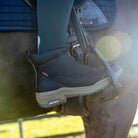 LeMieux Trex Waterproof Zip Boots = Black, shown on foot in stirrup | Malvern Saddlery