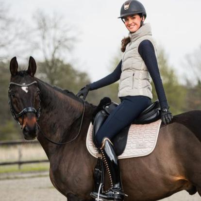 Schockemöhle Sports Marleen Style Quilted Ladies Vest - Cardamom, worn by rider on brown horse | Malvern Saddlery