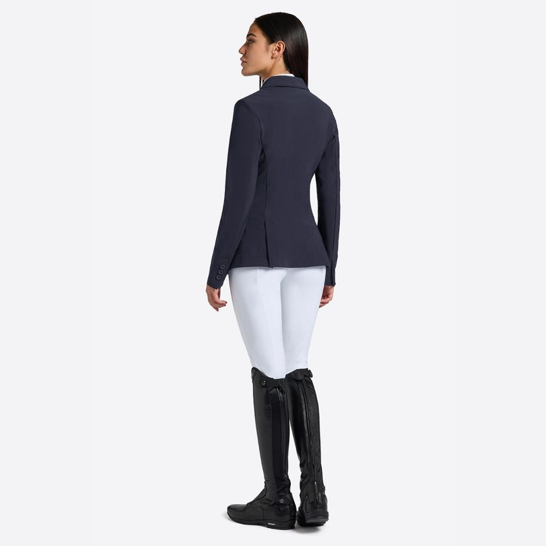 Rider's Gene Women's Jersey Competition Jacket - Navy; worn by woman wearing white breeches, black riding boots; back view shown on lt gray background | Women's Show Jackets | Malvern Saddlery