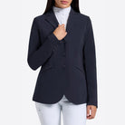 Rider's Gene Women's Jersey Competition Jacket - Navy; close up worn by woman wearing white breeches; shown on lt gray background | Women's Show Jackets | Malvern Saddlery