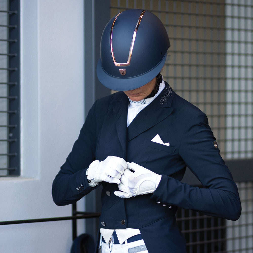 Tipperary Windsor MIPS® Equestrian Riding Helmet, navy with rose gold, shown on rider in show shadbelly | Malvern Saddlery