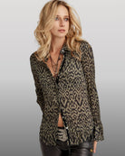 Cino Ikat Olive Button Down Shirt worn by woman on gray background | Malvern Saddlery