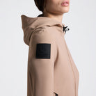 Cavalleria Toscana Women's Perforated Jersey Softshell Jacket - Brush [Beige]; close up side right arm logo patch | Ladies Riding Outerwear | Malvern Saddlery