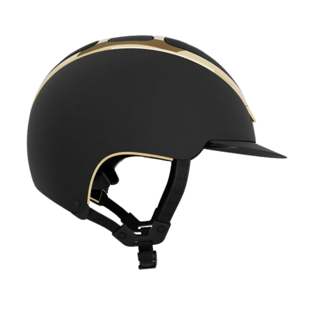 Kask Dogma Chrome Equestrian Helmet - Black Matte with Gold Frame;  side view on white background | Standard Brim English Riding Helmets | Malvern Saddlery