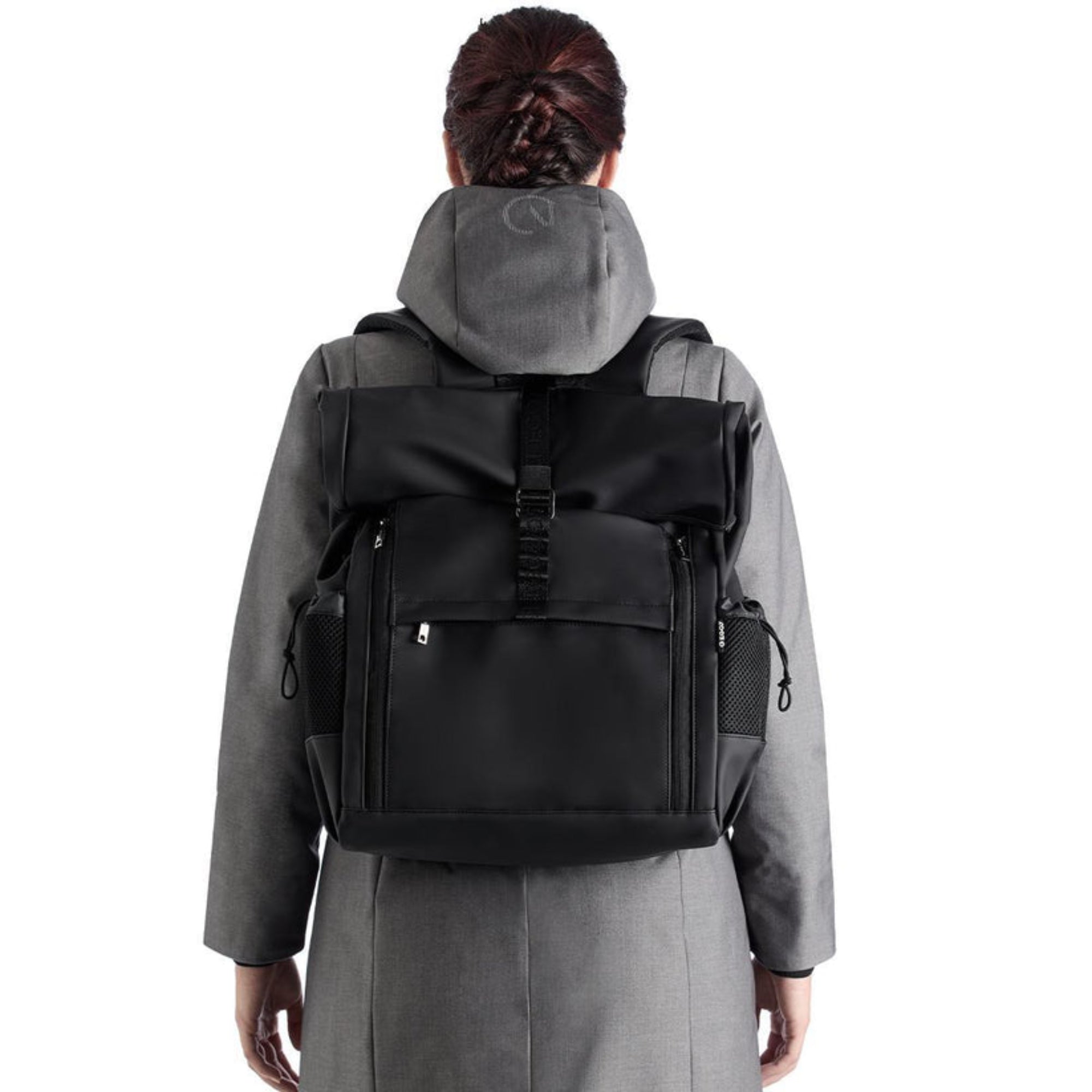Black EGO7 Axel waterproof equestrian backpack worn on back showing storage compartments and side mesh pockets
