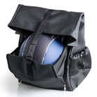 Black EGO7 Axel equestrian backpack open to reveal front helmet storage compartment holding a blue riding helmet